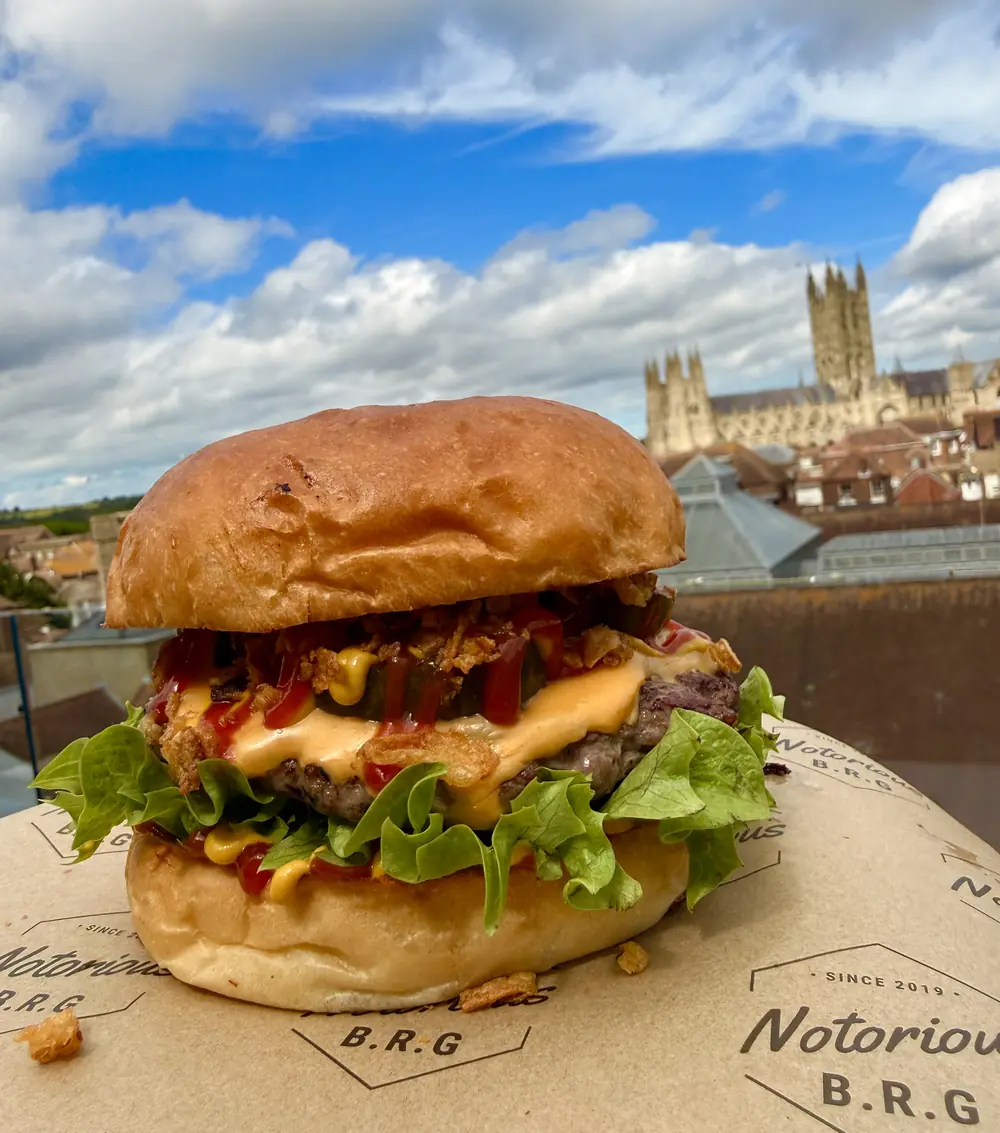 Notorious B.R.G cheeseburger on The Rooftop with Canterbury Cathedral behind